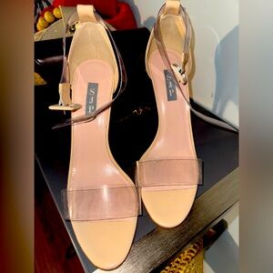 SJP nude and clear heels